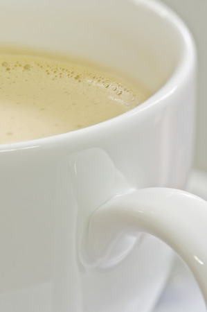 White cup of cappuccino coffee,shallow DOFの写真素材