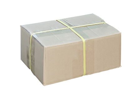 Closed and taped cardboard box isolated on white backgroundの写真素材