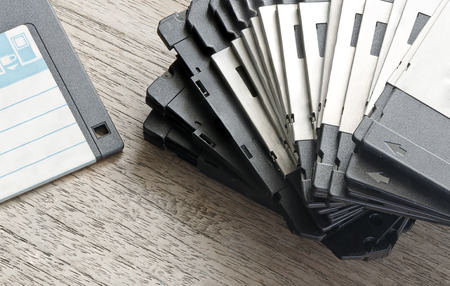 Stack of Used Floppy Diskettes  on Wooden tableの写真素材