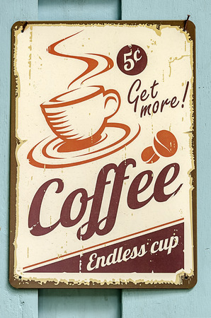 Vintage metal sign - Coffee endless cup on the wooden wall.の写真素材