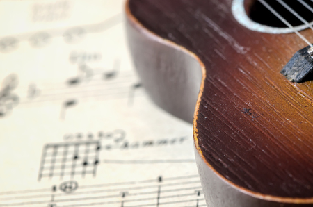 The old guitar on song book background,soft focus.の写真素材