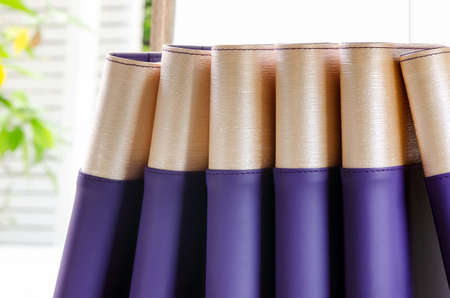 Stack of note books in nature light and background.の写真素材
