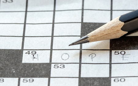 Black pencil on the Crossword puzzle paper.の写真素材