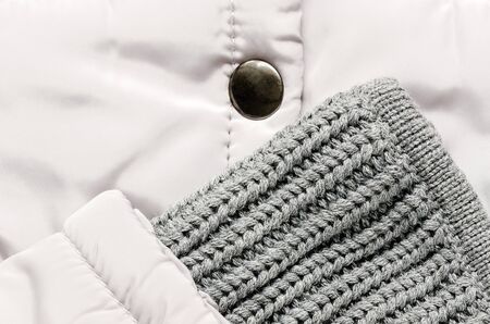 Jacket knitting wool sleeve in close up view.