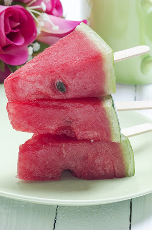 Stack of watermelon with ice cream sticks in close up view.の写真素材