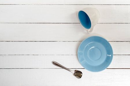 Empty Cup, saucer and spoon on wooden background,top view.の写真素材