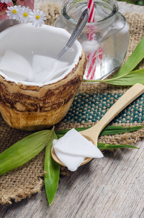 Fresh coconut and coconut juice on wooden background.の写真素材