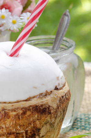 Fresh coconut and coconut juice on wooden background.Close up view.の写真素材