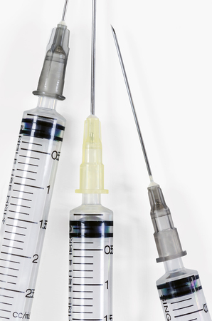 Empty hypodermic syringe on white background.の写真素材