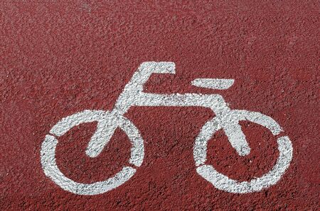 White painted sign for bikes on road.の写真素材