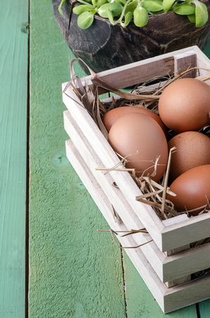 eggs in wooden box,eggs of hen in nature.の写真素材