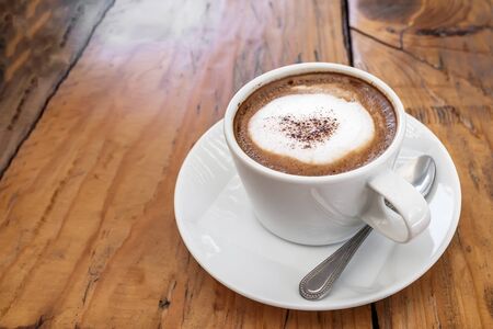A cup of coffee  on wooden backgroundの写真素材