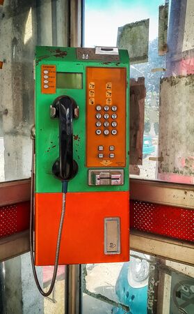 Old public telephone coin and cardの写真素材