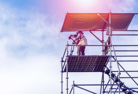 cameraman in action on the scaffolding