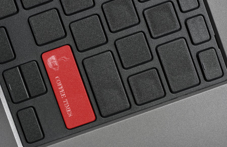 Break time Concept : COFFEE TIMES word on red button keyboard