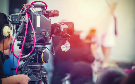 Video camera operator working with his equipment