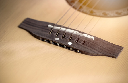 Close up shot of acoustic guitar,show guitar strings with shallow depth of field