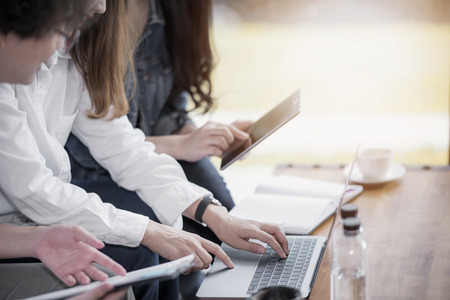 Young Coworkers Team Analyze Meeting Online using laptop and table.の写真素材
