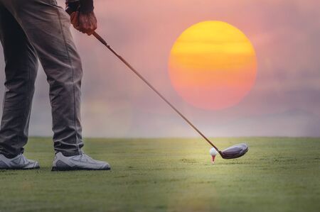 Cropped shot of men playing golf under the sunlight. copy space.の写真素材