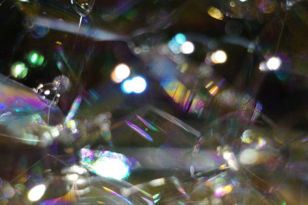 abstract background with bokeh defocused lights and soap bubblesの写真素材