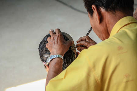 Shaved head. In order to prepare to study Buddhist religion. Thai Male Model.