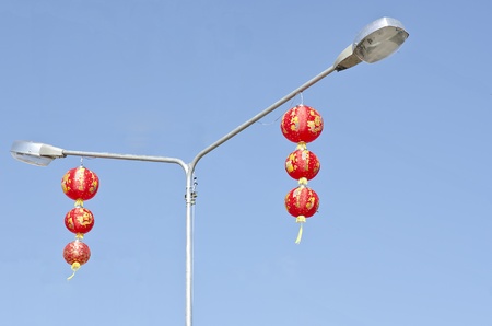 A photo of chinease lanterns that hang on the lighting pole の写真素材