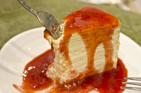 Crape cake topped with strawberry jam.の写真素材