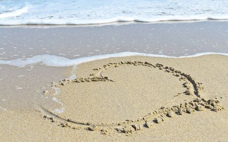 Heart drawn in the sand at samila beach songkhla thailandの写真素材