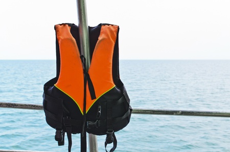 orange Life jacket and seaの写真素材