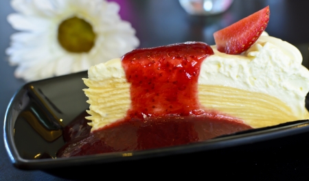 Crape cake topped with strawberry jam.の写真素材