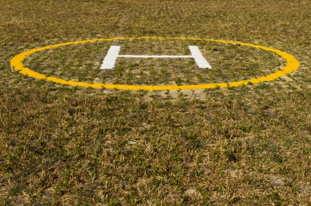 Helicopter landing pad on grassの写真素材