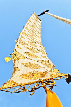 Flag of the Lanna Thai on blue sky at ChiangMai top north Thailand.の写真素材
