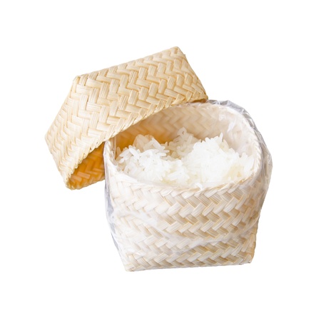 asian sticky rice in a bamboo wooden box isolated on whiteの写真素材
