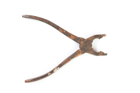 isolated vintage rusty pliers on whiteの写真素材