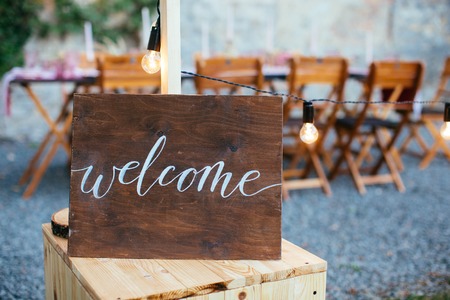 Wedding and party place decoration with wooden welcome signの写真素材