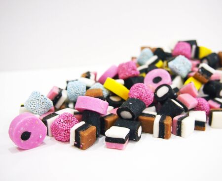 Colorful candy mix spilling to the left の写真素材