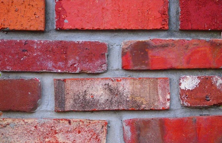 Brick wall with multi colored bricks  red, orange, etc   Good banner or background image for web or print の写真素材