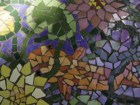 Sunlit tile with fish design.の写真素材