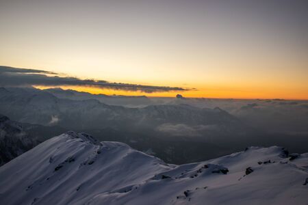 A view of a sunrise from the top of a himalayan mountainの写真素材