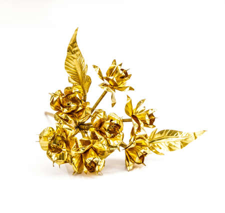 Brass flower on a white background の写真素材