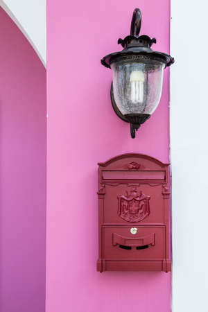 Red Mailbox on the pink wallの写真素材