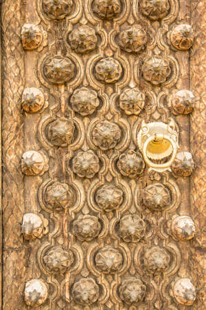 Close-up of old carved wooden doors の写真素材