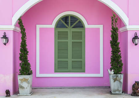 gray window on the pink wallの写真素材