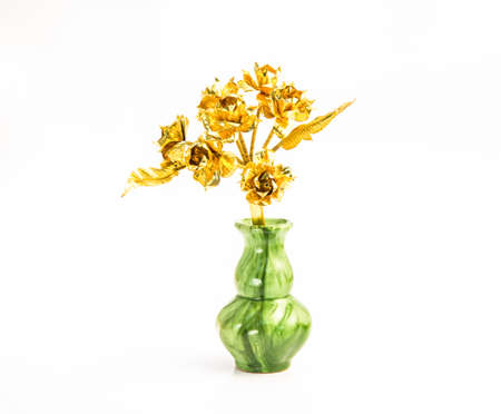 Brass flower in a white backgroundの写真素材