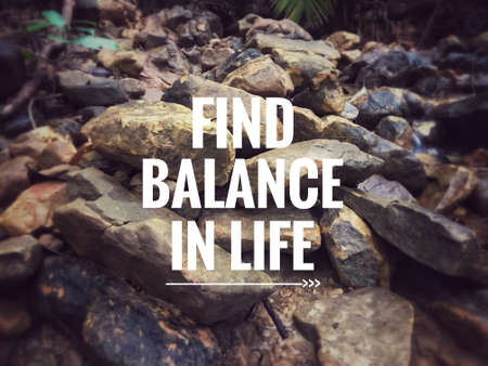 Motivational and inspirational quote - Find balance in life. With blurred vintage styled background.の写真素材