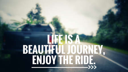 Motivational and inspirational quotes - Life is a beautiful journey. Enjoy the ride. With blurred vintage styled background.の写真素材