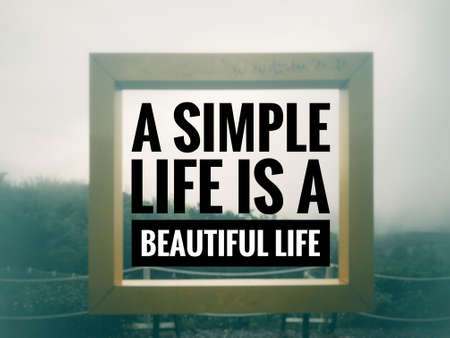 Motivational and inspirational quote - A simple life is a beautiful life. Blurred vintage styled background.の写真素材