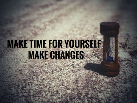 Motivational and inspirational quote - Make time for yourself, make changes. Blurred vintage styled background.の写真素材