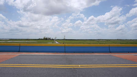 Colorful road crossing the lake located in Phatthalung , Thailand.