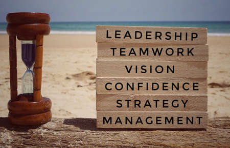 Business and financial Concept - Stacked wooden blocks with words â€˜Leadership, Teamwork,...